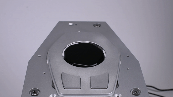 This video shows a close-up of the v2 working controller. In addition to robotically changing its diameter, it can also disappear in the arm rest. This was requested as a feature by the OEM we were working with. This hidden until in use capability would make sure that the knob is flush with the arm rest, unless it is getting used. This video also shows how fast, or slow, the device can change its diameter, and the wiggles it can produce using minute shape changes. Note that such wiggling is not the same as traditional haptics (vibration), since it uses the human sense of proprioception, and not the vibration senses in our fingers.